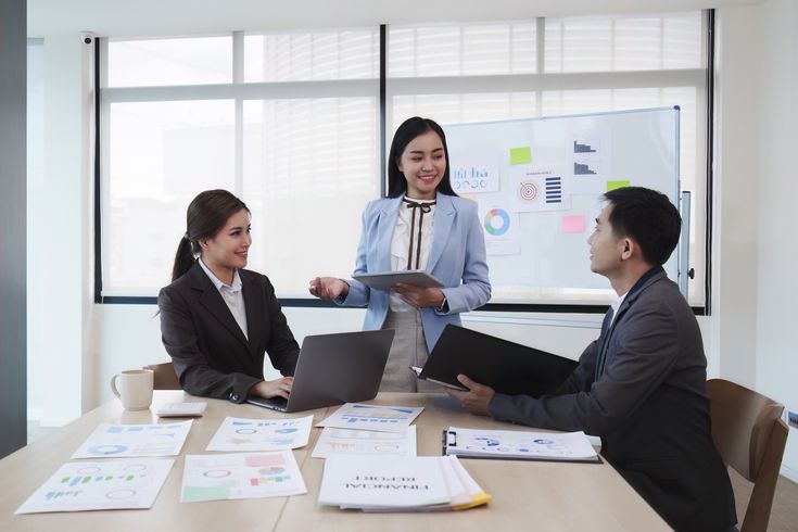 Business leaders meeting with financial consultant in Milan office